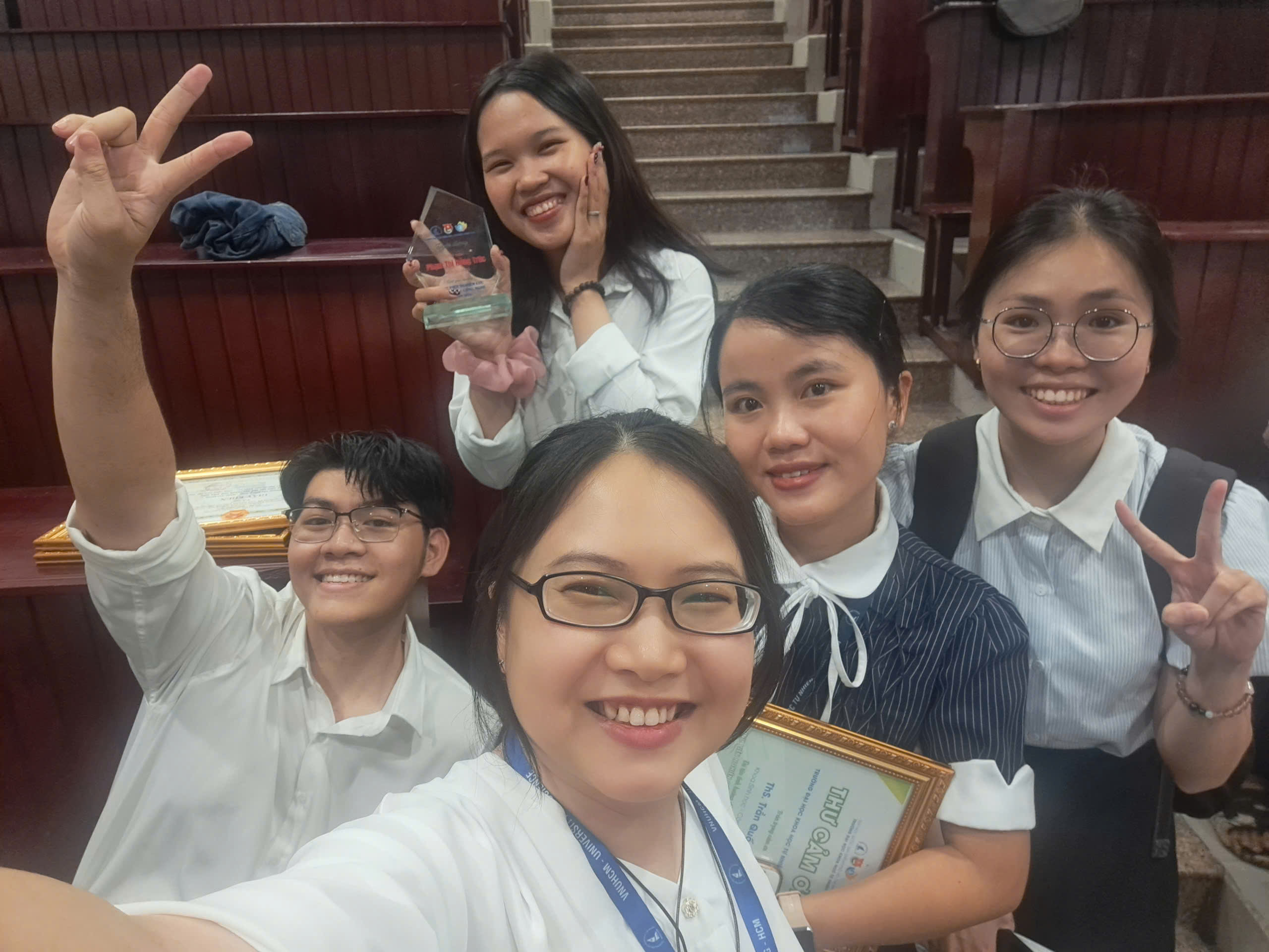 The team after the Eureka award ceremony — the trophy stays with the students, the work was theirs.
